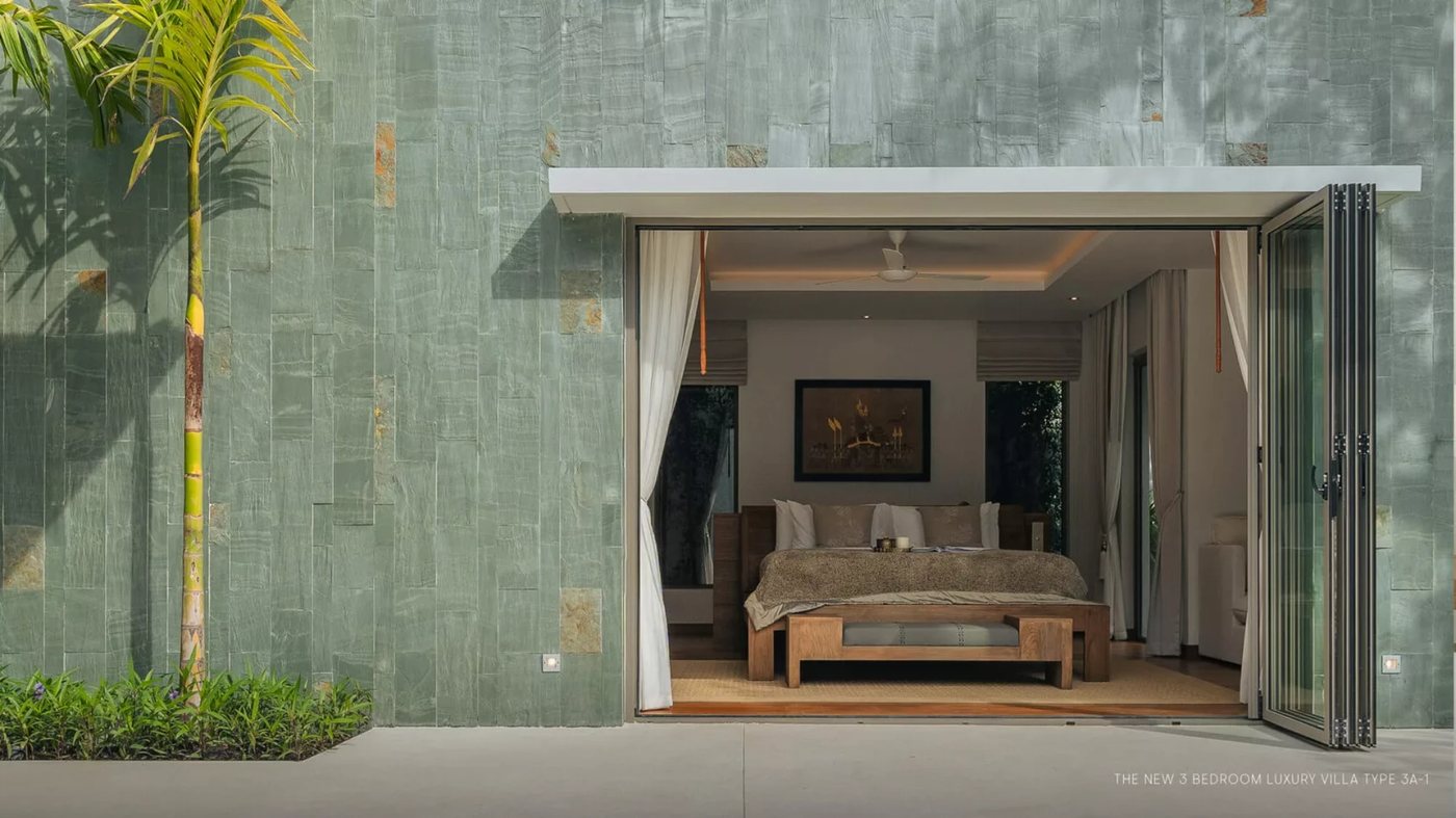 Anchan Indigo — stone-clad villa wall and tropical garden